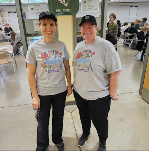 Math teachers Julie Ann Suderman and Kappy Nicholson show off their math shirts before class.

